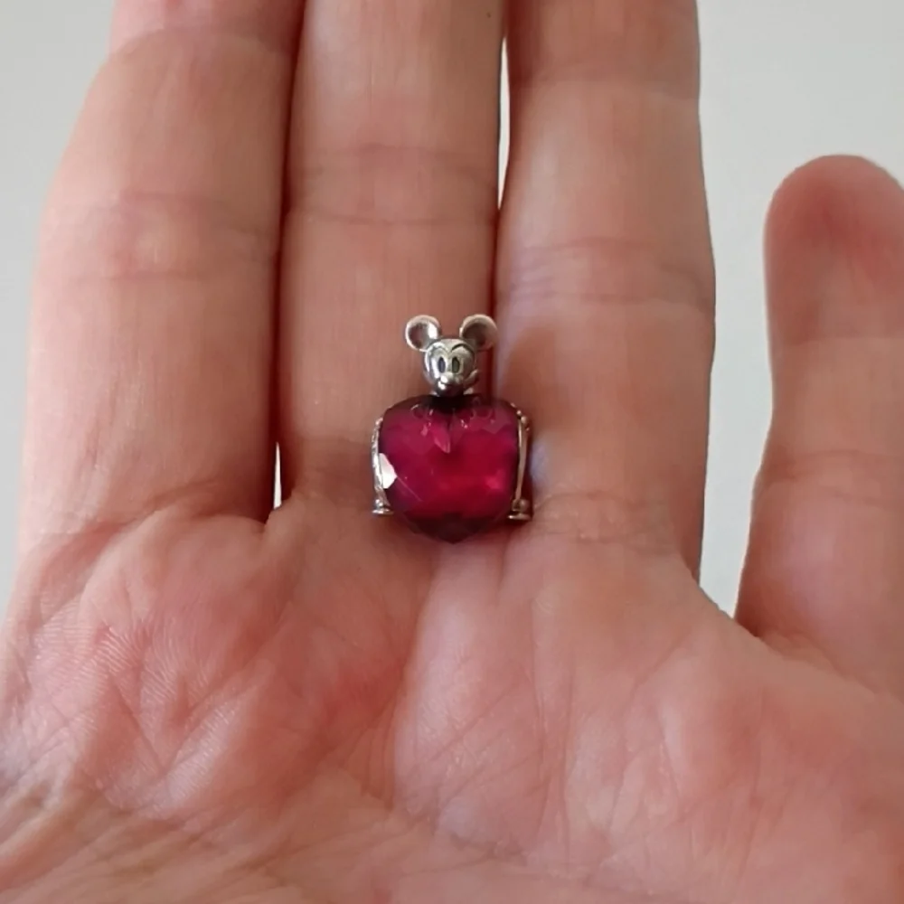 Pandora Disney Mickey Mouse Heart charm featuring a fuchsia crystal.